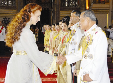 His Majesty the King is congratulated by Moroccan Princess Lalla Salma at the Ananda Samakhom Throne Hall in Bangkok Monday, June 12, 2006.