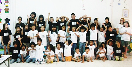 The children love their new T-shirts, donated by the Brotherhood Cafe.