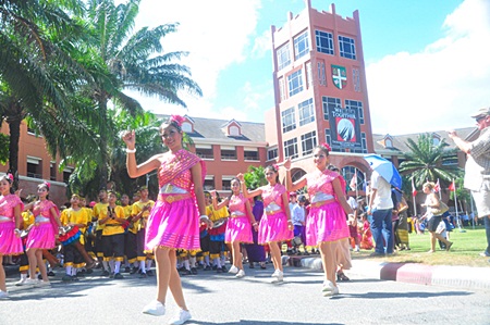 “The first performance of the day was by a local Thai school, their hands so elegantly curved, rhythmically moving to the beat of the song.”