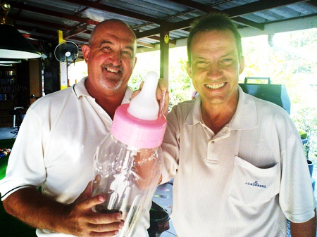 John Lawton presents Dennis (Div B winner)] with the “Boo Hoo Cup” at Pattaya Country Club.