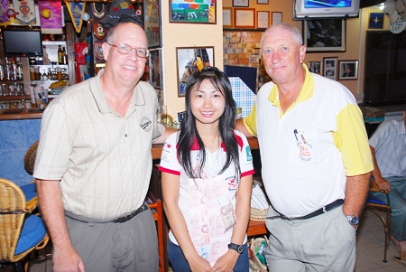 Tuesday’s winners, Brian Gabe (golfer of the month), left, and Tony Scambler, right, with Nim on her last day at Bert’s.