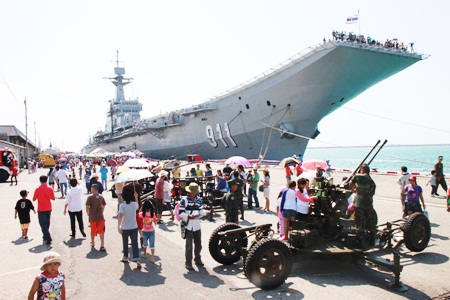 Parents take their children to see the HTMS Chakri Naruebet.