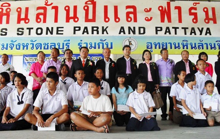 Officials at the Crocodile Farm give away 100 scholarships, each worth 1,000 baht.