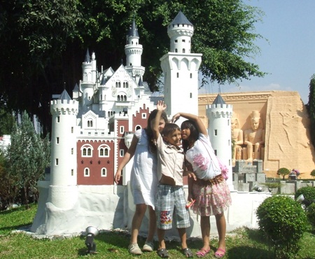 Posing in front of a magic castle at Mini Siam.