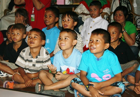 The children enjoy the magic show.