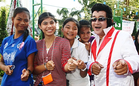 The girls from the Pattaya Orphanage are happy to meet Elvis.