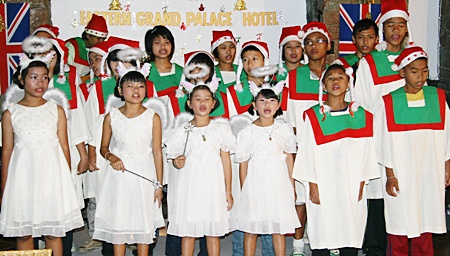 Children from the Father Ray Children’s Home sing carols.