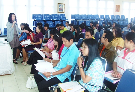 Lecturer Manee Thadabodin (far left) speaks to seminar participants about drug use and peer pressure at local schools.