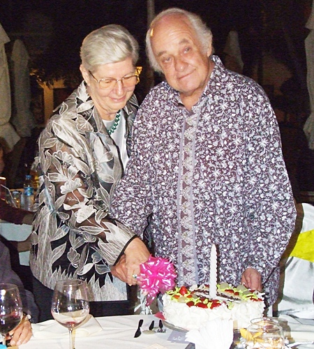 Sabine helps to cut the birthday cake as a visibly moved Ferenc has this far away look.