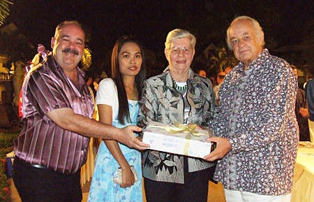 Jack and Jintana Levi, present a gift to Sabine and Ferenc.