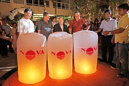 Lon Ballard, Rony Fineman, Dr. Hari Harilela and Michael Procher getting ready to release lanterns for good luck.