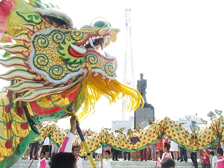 Dragon dancers perform at the Prince Chumporn Khet Udomsak Monument on Pratamnak Hill.