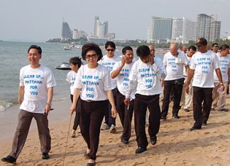 Vasana Khwanmuang, 3rd left, leads volunteers on a beach cleaning exercise on Monday, March 14.