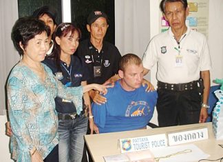 Owner Araya Lertkitsathaporn (left) and tourist police volunteers managed to detain Alexander Trofimenko.