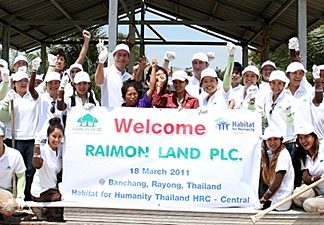 The Raimon Land team poses for a photo at the Ban Chang building site.