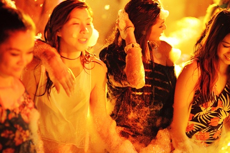 The girls talk time out from the competition to relax at the Hardrock’s foam party.