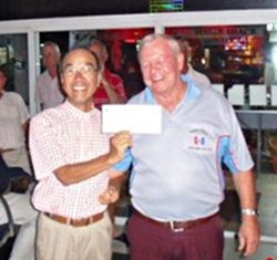 Low Gross winner Mashi Kaneta, left, with the PSC Golf Chairman Joe Mooneyham.