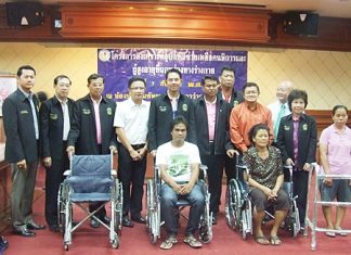 Mayor Itthiphol Kunplome presides over the distribution of 263 pairs of glasses, four wheelchairs and five walkers to elderly, disabled and visually impaired residents.