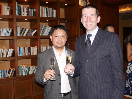 Anuchit Saeng-on and MD Michael Delargy raise their glasses to a good evening had by all.