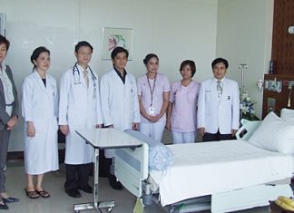 Hospital Director Dr. Pichit Kangwolkij (right) and a team of doctors announce the soon to be open IMCU.