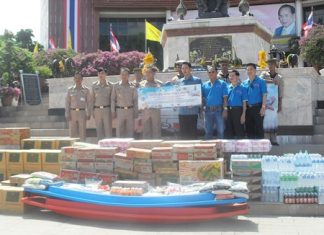 Officials from the Navy receive donated goods from the mayor and Walking Street committee to help flood-relief efforts around Thailand.