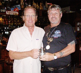 Peter Hammond (left) receives his Cafe Kronborg December Monthly Mug from Bjarne.