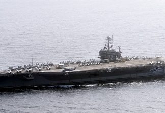 Official U.S. Navy file photo of the Nimitz-class aircraft carrier USS Abraham Lincoln (CVN 72) underway in the U.S. 7th Fleet area of responsibility as part of a deployment to the western Pacific and Indian Oceans en route to support coalition efforts in the U.S. 5th Fleet area of responsibility. (U.S. Navy photo by Mass Communication Specialist 3rd Class Adam Randolph/Released)