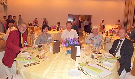 (L to R) Chris Thatcher, a British Chamber of Commerce Thailand director; Anutra Sinchaipanich, director at Caterpillar (Thailand) Co. Ltd.; Alex Tovsen, Ralf Skoropa, and Simon Landy, BCCT chairman prepare for a sumptuous meal.