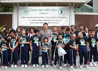 Nijjaporn Marprasert (center) welcomes young blind students to the Siam Bayview Hotel.