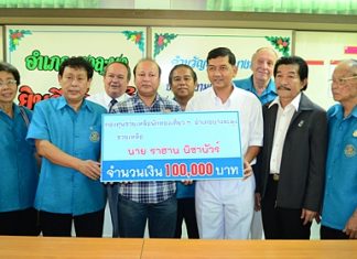 Jahangir Hossain (center), head of Pattaya’s Bangladesh community, representing 3 recent Bangladeshi crime victims, accepts aid from Banglamung District Chief Chawalit Saeng-Uthai.