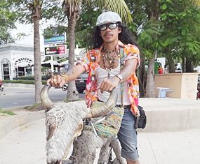 Sunya Sompu turns heads when riding around town on his water buffalo bike.