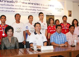 Pattaya Mayor Ittipol Kunplome, President of Thailand Windsurf Association, and Sonthaya Khunplome, President of Chonburi Sports Association, seated center, chair the welcoming committee for the successful Thai windsurfers, standing rear.