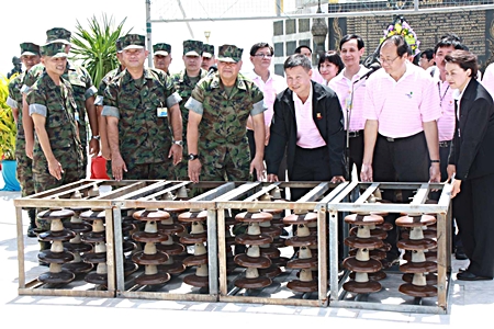 EGAT officials and top Navy brass announce the handover of electrical parts designated to be used to form an artificial coral reefs. 