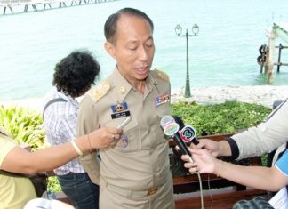 Chonburi Gov. Khomsan Ekachai answers media questions during the emergency drill.