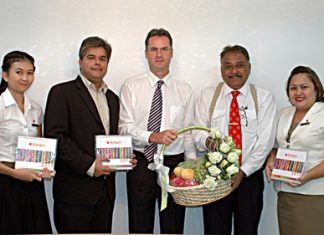 Resident Manager Richard Margo (centre), Alisa Sribuddee (left) and Public Relations Manager Pichaya Nitikarn (right) of Amari Orchid Pattaya stopped by to congratulate Peter and Tony Malhotra on the successful move to our new business premises on Thepprasit Road recently.
