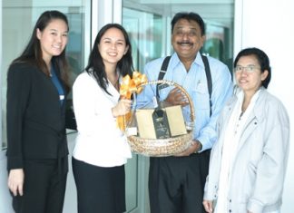 Peter Malhotra, MD of Pattaya Mail Media Group, is elated as he receives a basket of good cheer from Victoria Arnold, PR & Marketing Communications Manager, and Somruthai Chomrat (left), Assistant Marketing Communications Manager from the Royal Cliff Hotels Group with greetings from the top management of the Royal Cliff. At right is Primprao Somsri, Advertising Sales & Marketing Manager of the Pattaya Mail Media Group.