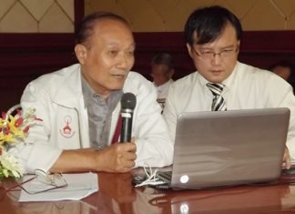 Asst. Prof. Narong Kularb (left), traffic engineer / consultant for the Pattaya underpass project, and K. Jirawat, civic engineer from Punya Technology Co. Ltd. (right), listen to opinions about the proposed Sukhumvit underpasses.