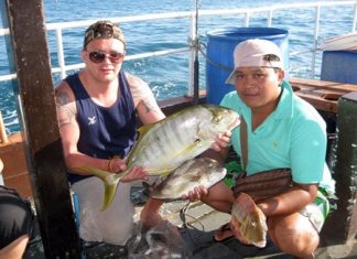 Lee Gerrard (left) and his brother in-law (right) hold up a beautiful trevally and a couple of nice sized snapper caught on Jan. 14.