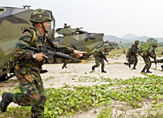 Royal Thai Marines move up Hat Yao beach during an amphibious assault rehearsal for exercise Cobra Gold 2013 Feb. 13. The amphibious assault combined the capabilities of U.S. Company A, Battalion Landing Team 1st Battalion, 5th Marine Regiment, 31st Marine Expeditionary Unit, and Royal Thai Marines in a bilateral attack as part of this year’s Exercise Cobra Gold exercises. (Photo by III Marine Expeditionary Force/MCI Pacific)