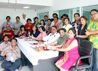 Marlowe and Peter Malhotra (seated, 2nd & 3rd right) lead the Pattaya Mail “family” in traditional Songkran blessings.