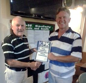 Tony presents the KPK voucher to Colin Greig.