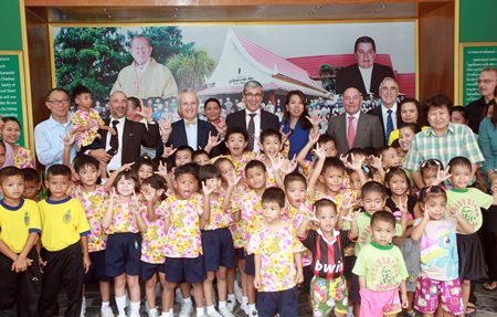 French Ambassador H.E. Thierry Viteau and his aides pose for a fun group photo with children and administrators of the Pattaya Orphanage.