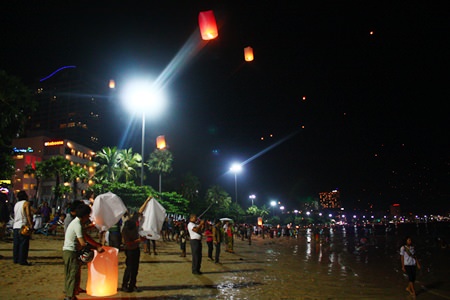 The night sky is filled with dots of light coming from the thousands of khomloys launched from Pattaya Beach.