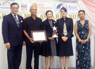 The Human Help Network Foundation accepts their award for earning 3rd Runner-Up for Thailand at the 2013 NGO Awards.