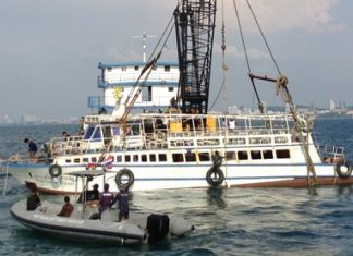 Pattaya salvage teams use slings to raise the Koh Larn Travel ferry that sunk Nov. 3, killing seven and injuring scores more.