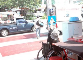 It appears designers of the newly built speed bumps / wheelchair crossings forgot another important detail, as the newly installed pedestrian signal stop buttons have been placed too high for wheelchair users to reach.