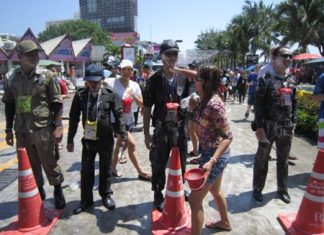 About 1,000 police officers and volunteers will slog through Pattaya April 19, just like these men, to provide security for the city’s Songkran finale.