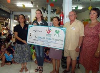 PILC members and friends hand over 62,000 baht to the Hand to Hand nursery preschool behind Duck Square near Big C in South Pattaya.