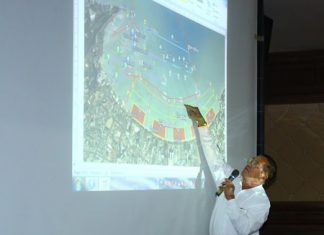 Sanit Boonmachai, member of Pattaya City Council and president of the Pattaya Tourist Boat Club points out some of the details of the new plan.