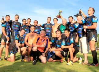 Phuket Vagabonds pose with the trophy after winning the Cup final at the 14th Chris Kays Memorial Pattaya Rugby 10’s tournament at Horseshoe Point Resort, Sunday, May 4. (Photo courtesy Harpic Bryant)